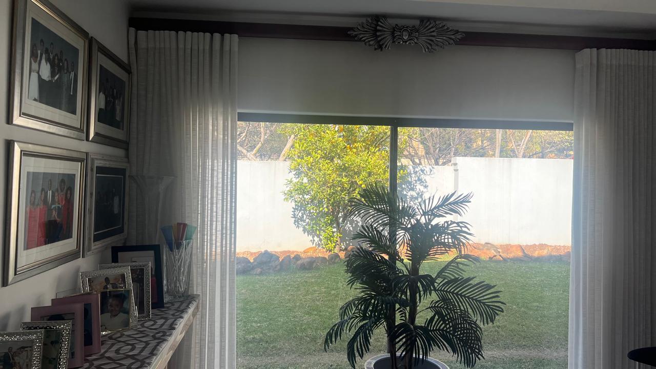 Sheer wave curtains, garden-view bay window